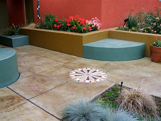 custom stained concrete patio, concrete planter boxes, and concrete benches