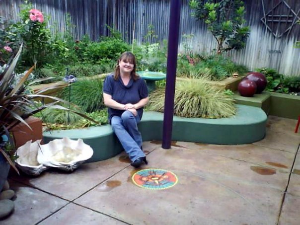 color stained concrete patio with color stained raised concrete planter beds, outdoor living