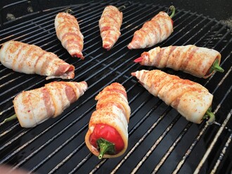 BBQ grilled cream cheese stuffed bacon wrapped jalapeno poppers